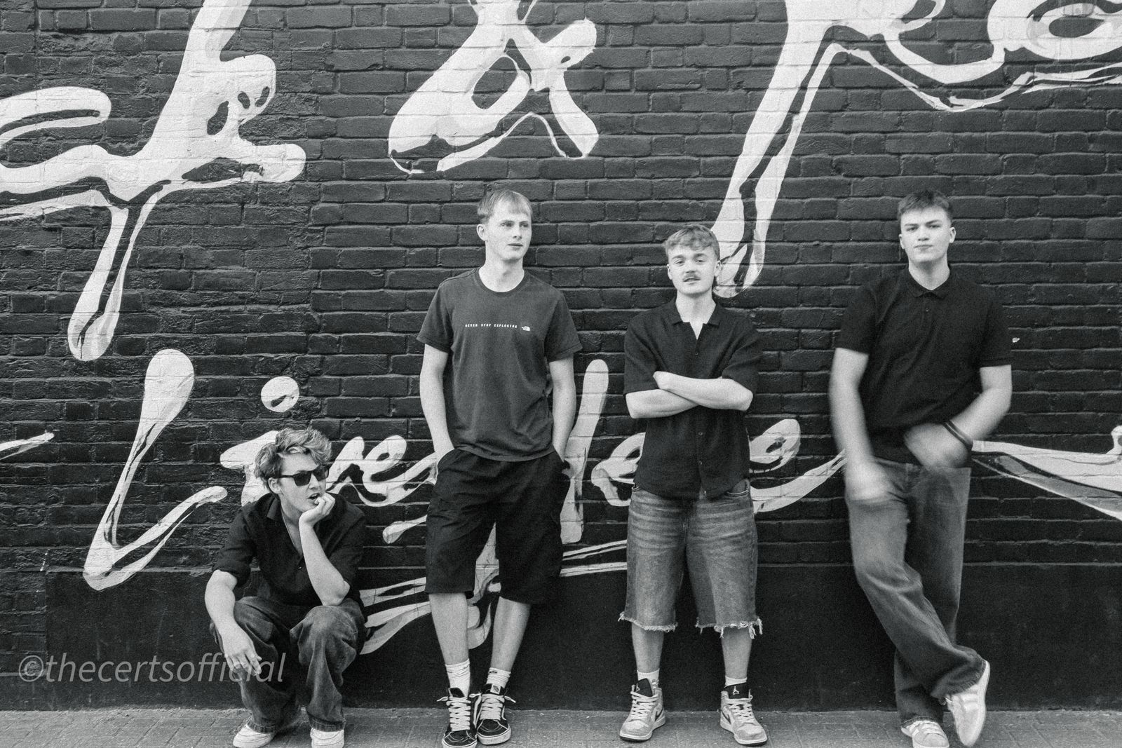 Band against a painted brick wall